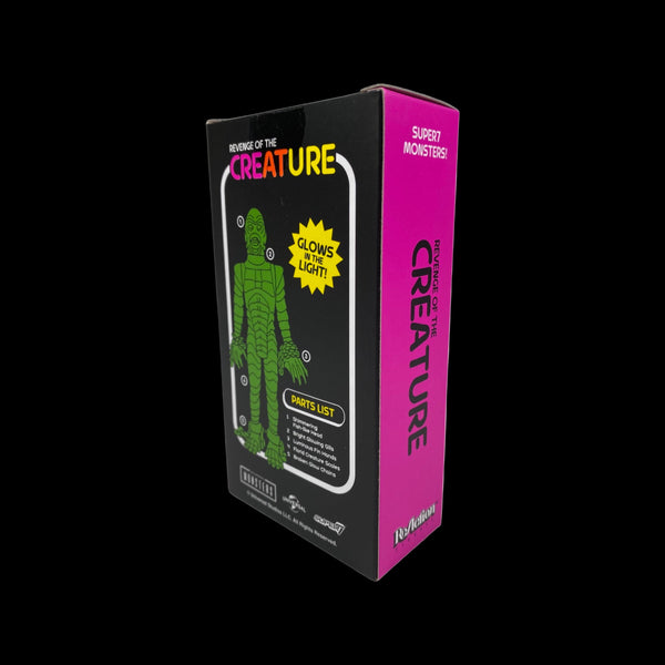 Box packaging of 'Super Monsters' with a green creature illustration on a black background