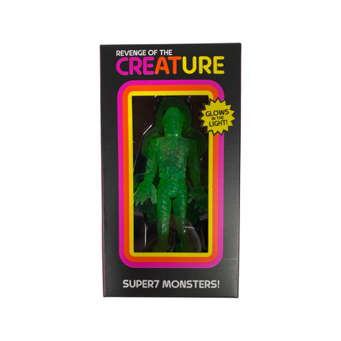 Packaged action figure toy depicting the Creature from the Black Lagoon, with GLOWS-IN-THE-LIGHT label on the box.